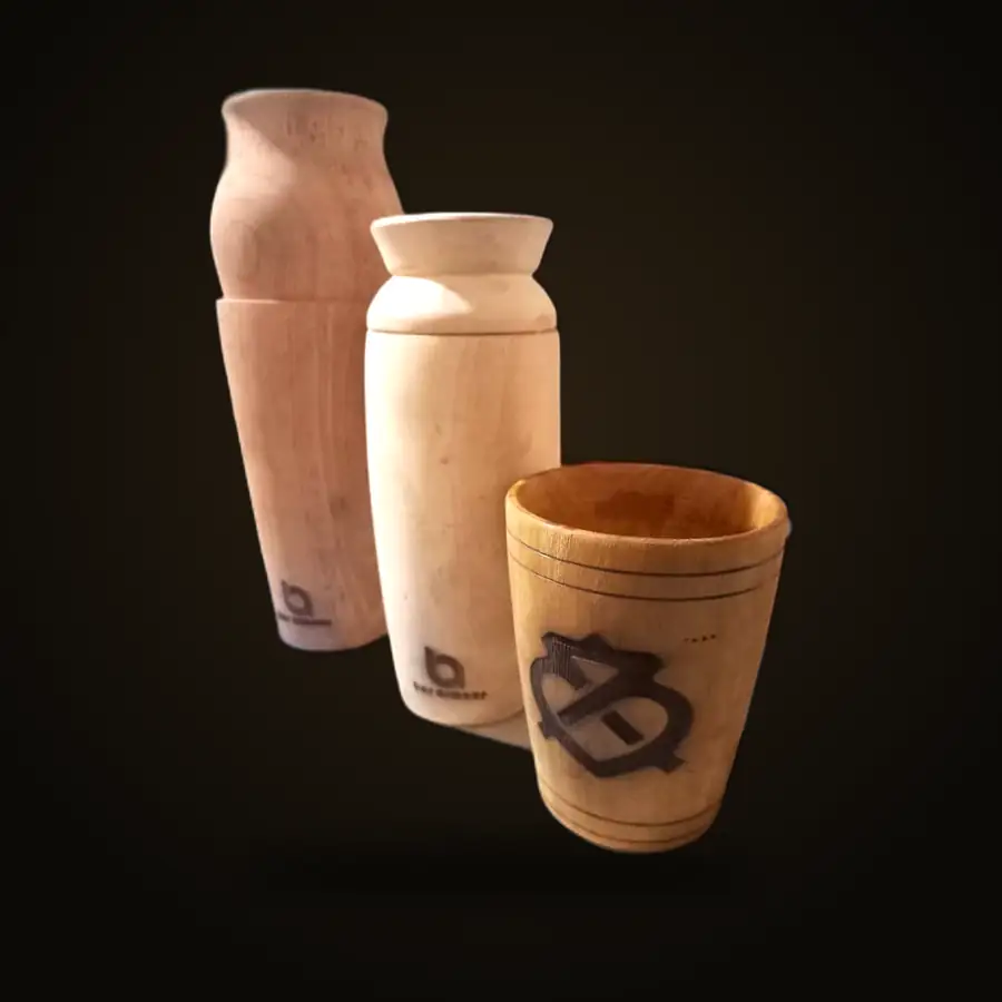 Hand-turned shakers and an Adinkra-engraved cup