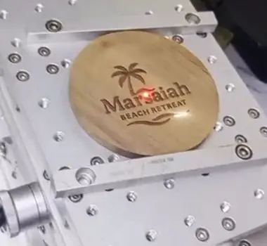 Laser engraving a coaster in the atelier